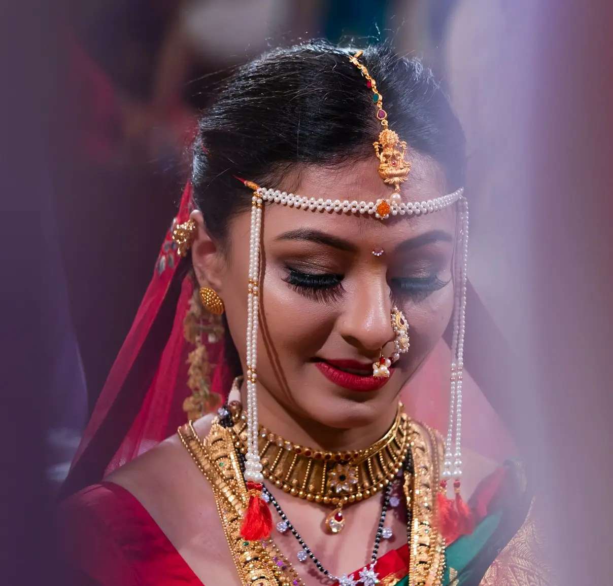 woman wearing gold-colored necklace